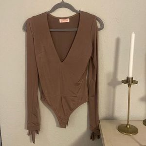 Blush body suit, size medium